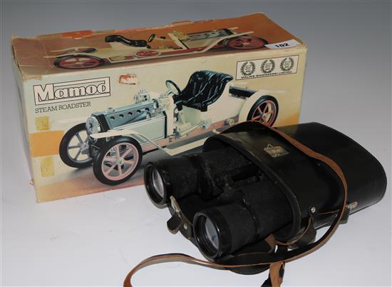 A boxed Mamod steam roadster and a pair of binoculars